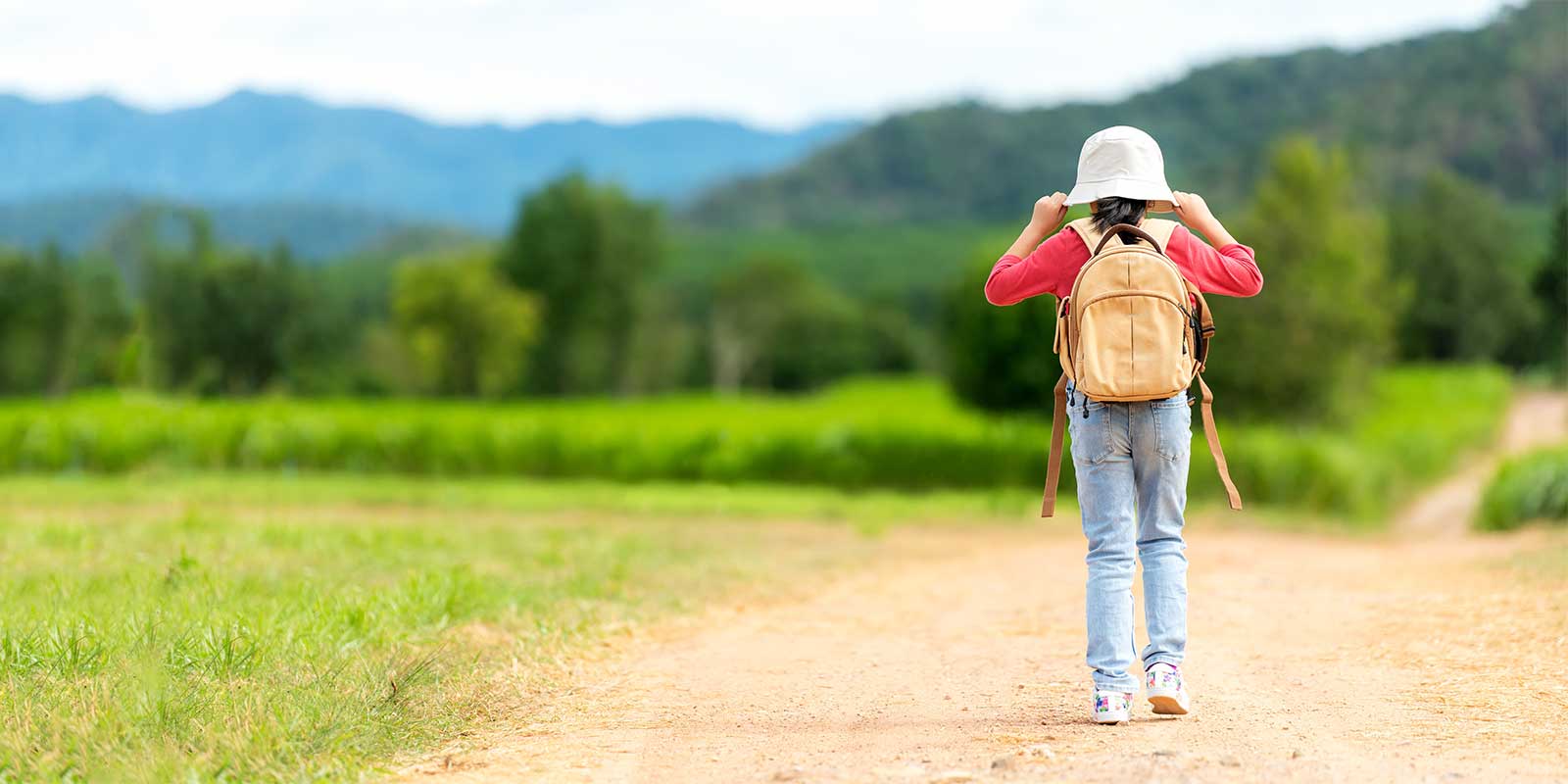 Girl walking ahead whilst on family holiday