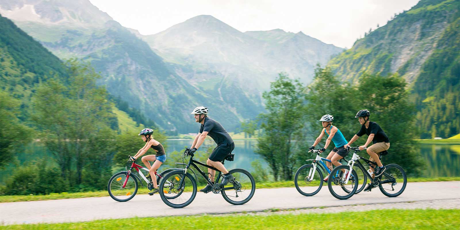 Family of four cycling in Austria