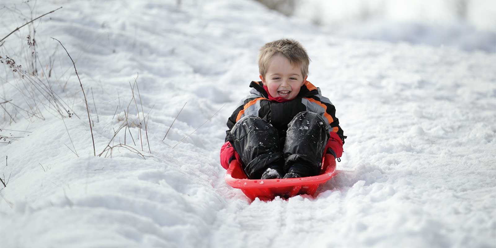 Boy sledging in Finland