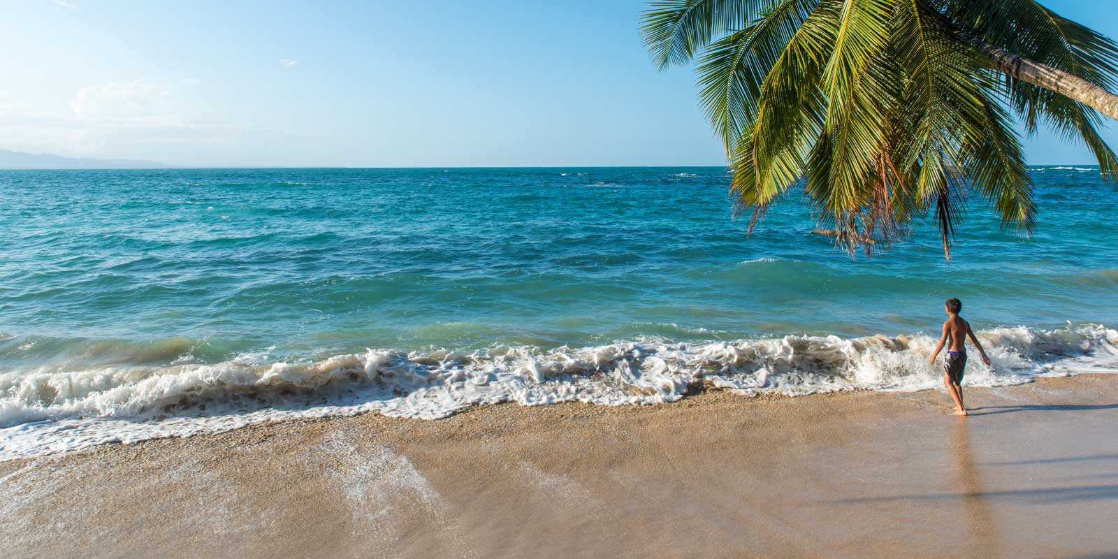 Boy on the beach in Costa Rica