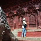 Woman exploring a temple in Nepal.