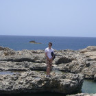 Exploring rocks at sea in Gozo, Malta
