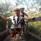 Family walking across a high bridge in Costa Rica.