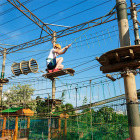 Young boy enjoying an adventure park