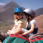 Two girls on a mule ride up the Atlas Mountains in Morocco
