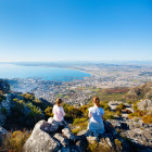 Two young girls looking out to sea in South Africa