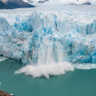 Section of Perito Moreno glacier breaking off into lake, Los Glaciares National Park in Argentina