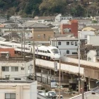 The JR train passing through the city of Beppu, Japan.