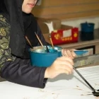 Woman batik painting in Kuala Lumpur, Malaysia.