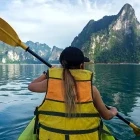 Girl kayaking in Khao Sok National Park, Thailand