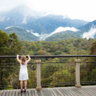 Girl overlooking Mount Kinabalu Peak in Borneo