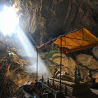 Bronze Buddha at Tham Phu Kham Caves in Laos