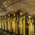 Golden Buddha statues in Dambulla Cave Temple, Sri Lanka