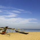 Traditional fishing boat on a beach in Negombo, Sri Lanka