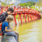 Father & son at Hoan Kiem Lake in Hanoi, Vietnam