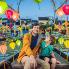 Father and son in a boat in Hoi An, Vietnam