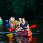 Family canoeing on the Jizerka River in Czech Republic