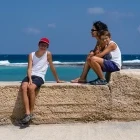 Family visiting Marsalforn Bay in Gozo