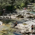 People swimming in Mostnica Gorge in Slovenia