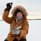 Man ice fishing in Sweden