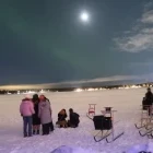People gathered to witness the Northern Lights, in Sweden