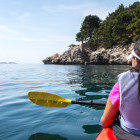 Girl kayaking in Croatia