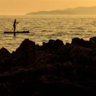 Stand-up paddleboarding at sunset in Croatia