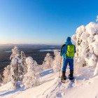 Man snowshoeing through Lapland countryside in Finland