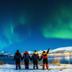 Group watching the northern lights in Finland