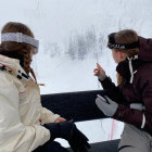 Siblings on a ski lift in Finland