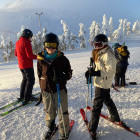 Siblings skiing in Finland