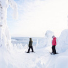 Siblings snowshoeing in Finland