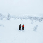 Siblings snowshoeing in Finland