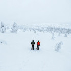 Siblings snowshoeing in Finland
