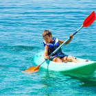 Boy kayaking in Crete, Greece
