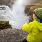 Boy looking down to Gulfoss in Iceland