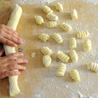 Child making gnocchi in Italy