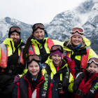 Happy family on RIB boat trip in fjord in Norway