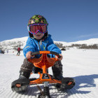 Young boy on snow racer in Myrkdalen, Norway