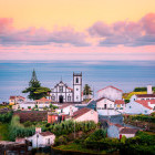 Pink sunrise over a village on São Miguel Island, the Azores