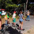 Children learning to skateboard in Portugal