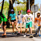 Children learning to skateboard in Portugal