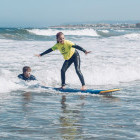 Girl learning to surf in Portugal