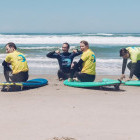 Parents learning to surf in Portugal