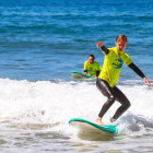 Boy learning to surf in Portugal
