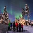 Group watching the Northern Lights in Finland