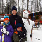 Family picture with a snowman in Slovakia