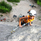 Boy rock climbing in Slovenia