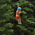 Boy ziplining in Slovenia
