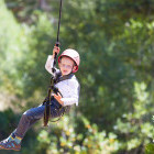 Boy ziplining in Slovenia